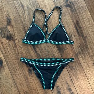 Black, small, Victoria secret bikini with green crochet detail. Gently used.